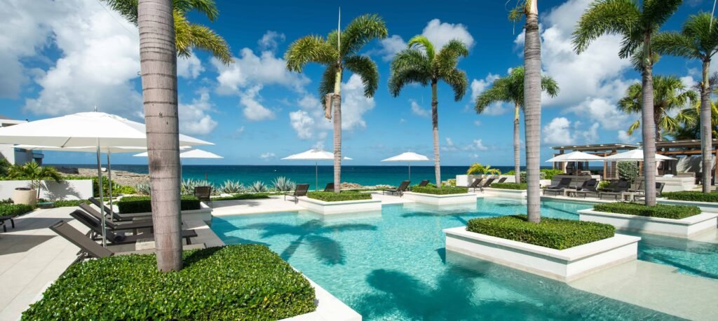 Anguilla island, Anguilla British West Indies Four Season Resort pools and gardens over a cliffs with Barnes Bay view