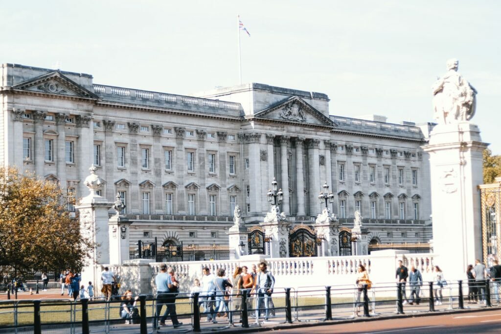 people standing in front of white concrete building