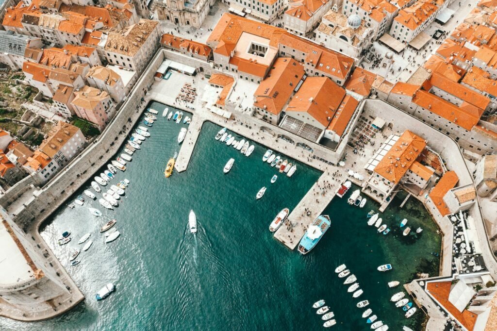 old city port with moored ships and historical houses