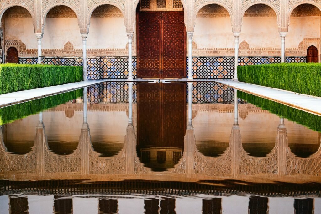 reflection of alhambra palace on the swimming pool